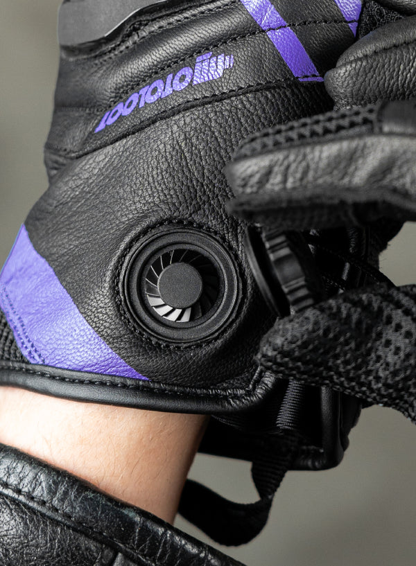 Black and purple glove with a magnetic fidlock closure
