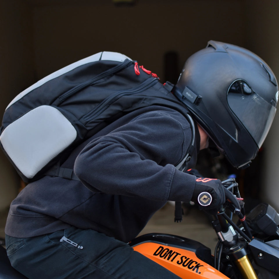 Sore shoulders. Helmet knocking the bag. There's a better way.
