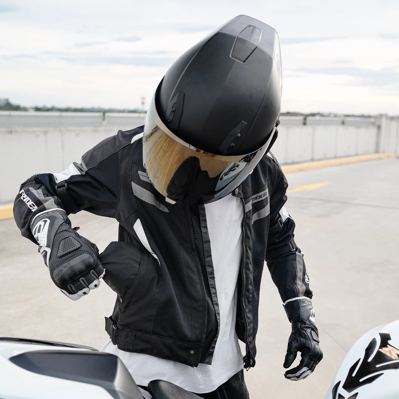 gloves and helmet on seat of a motorcycle Foldable Motorcycle Backpack
