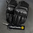 Black motorcycle gloves with keychain labeled 'Dead Inside' on a gray background