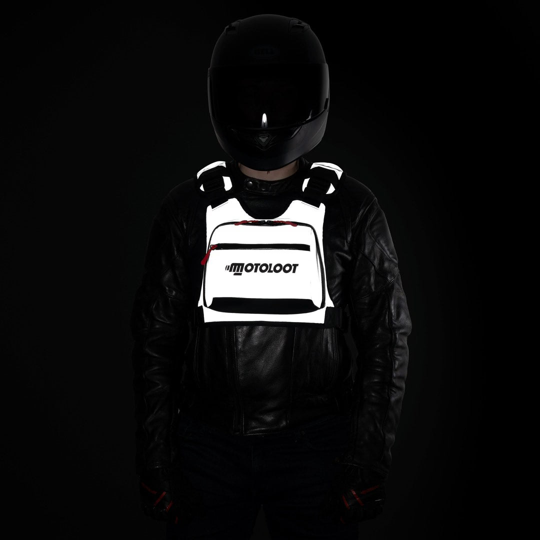 Chest Rig Pro at night turning front to back, reflective panels lit